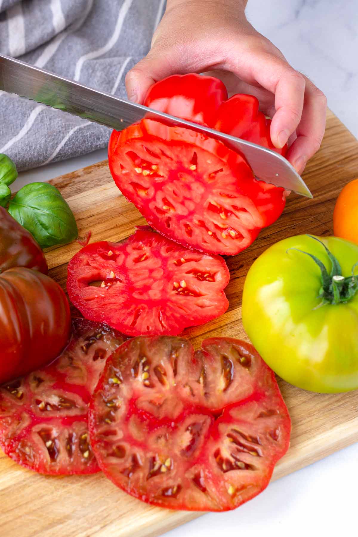 slicing an heirloom tomato