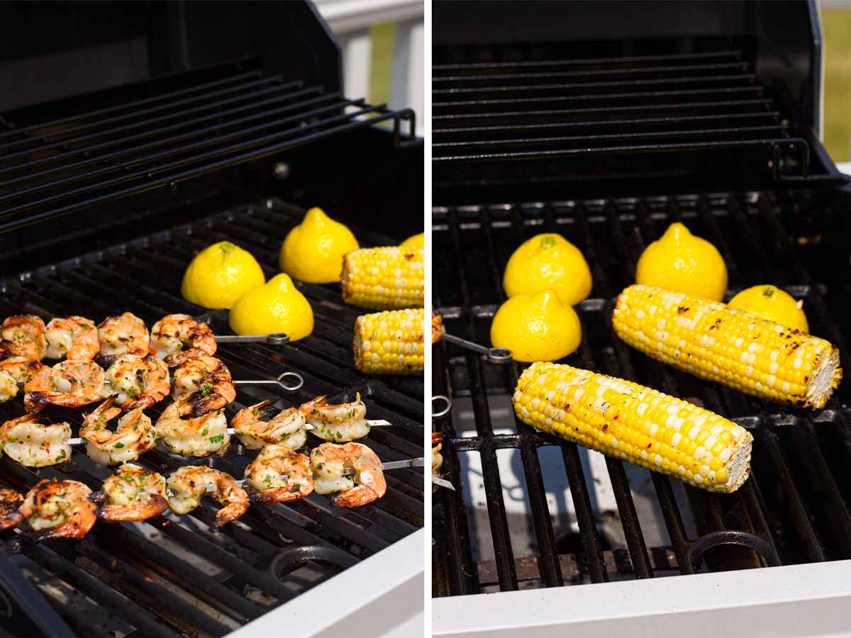 cooking shrimp skewers, corn, and lemons on grill
