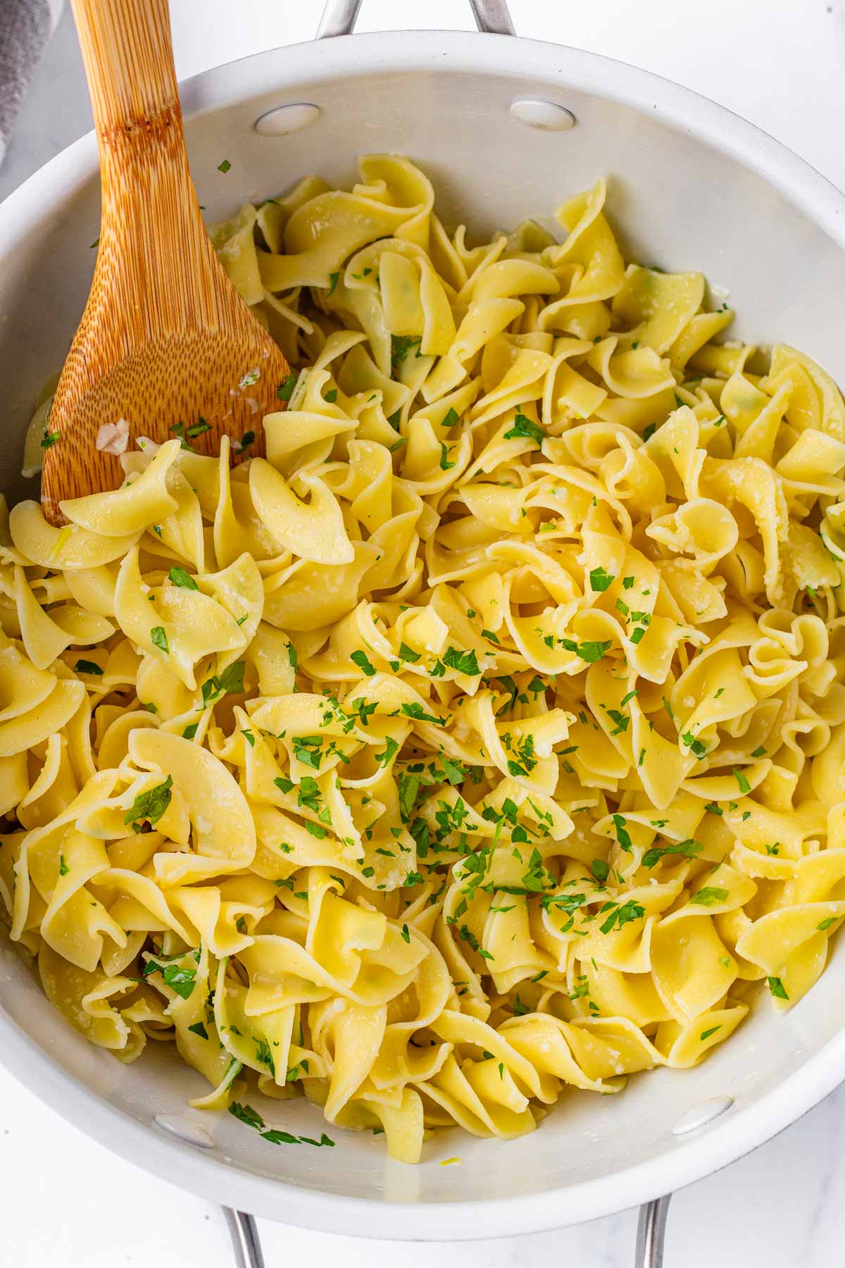 buttered noodles with garlic and parmesan in a pan