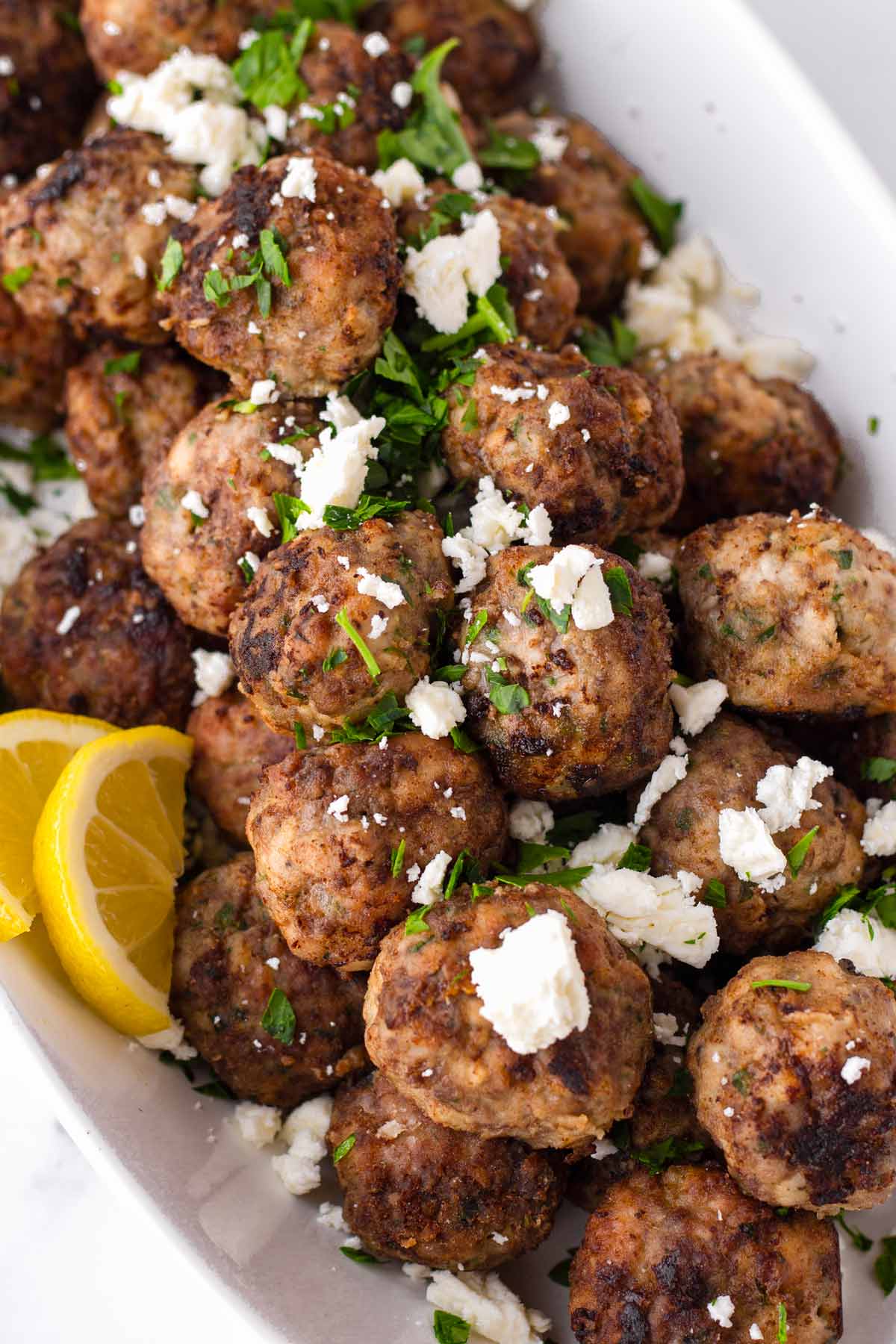 stacked greek meatballs with feta garnish