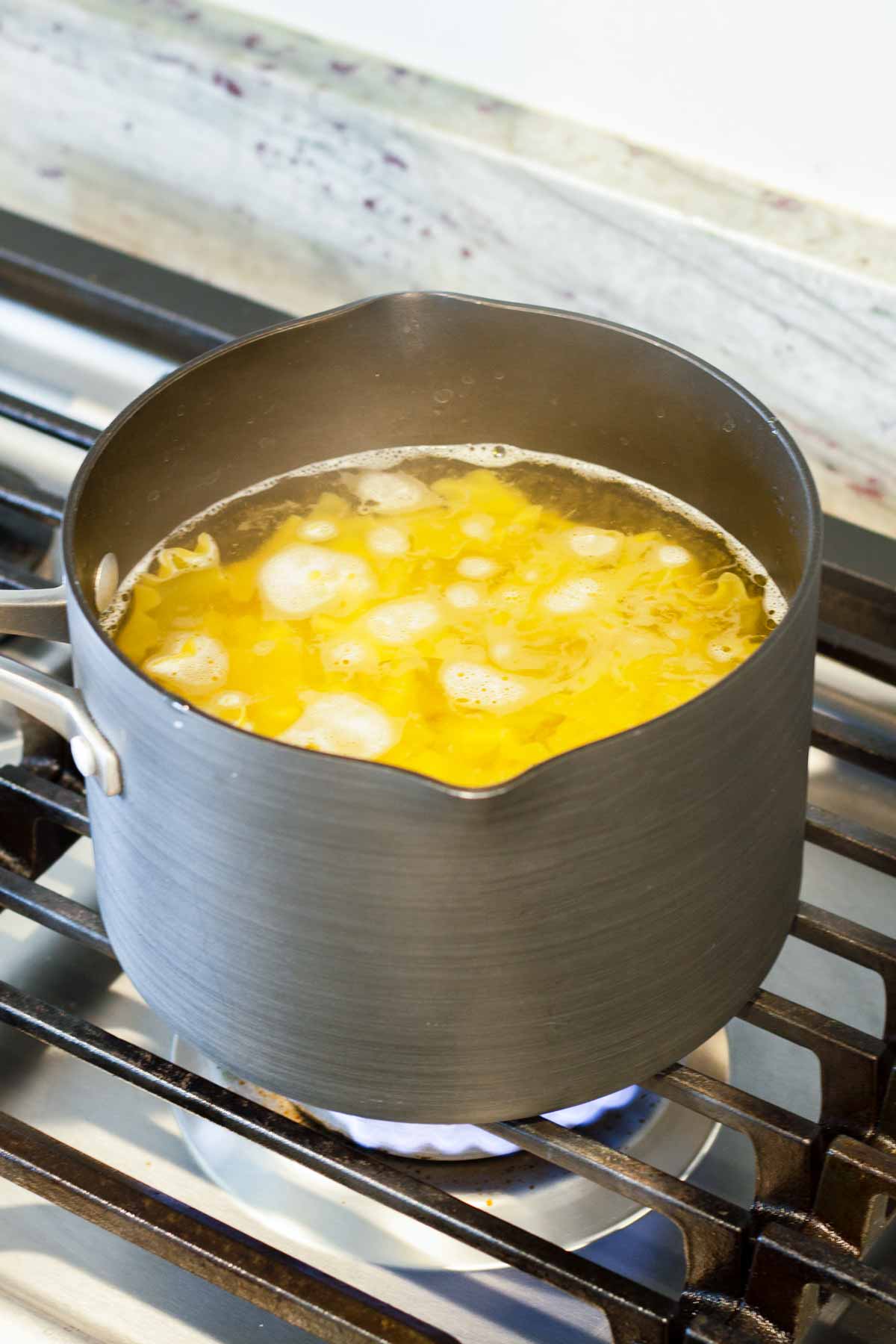 cooking pasta in a small pot