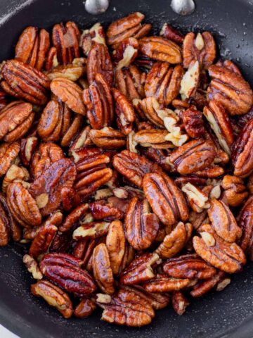candied pecans on a nonstick skillet