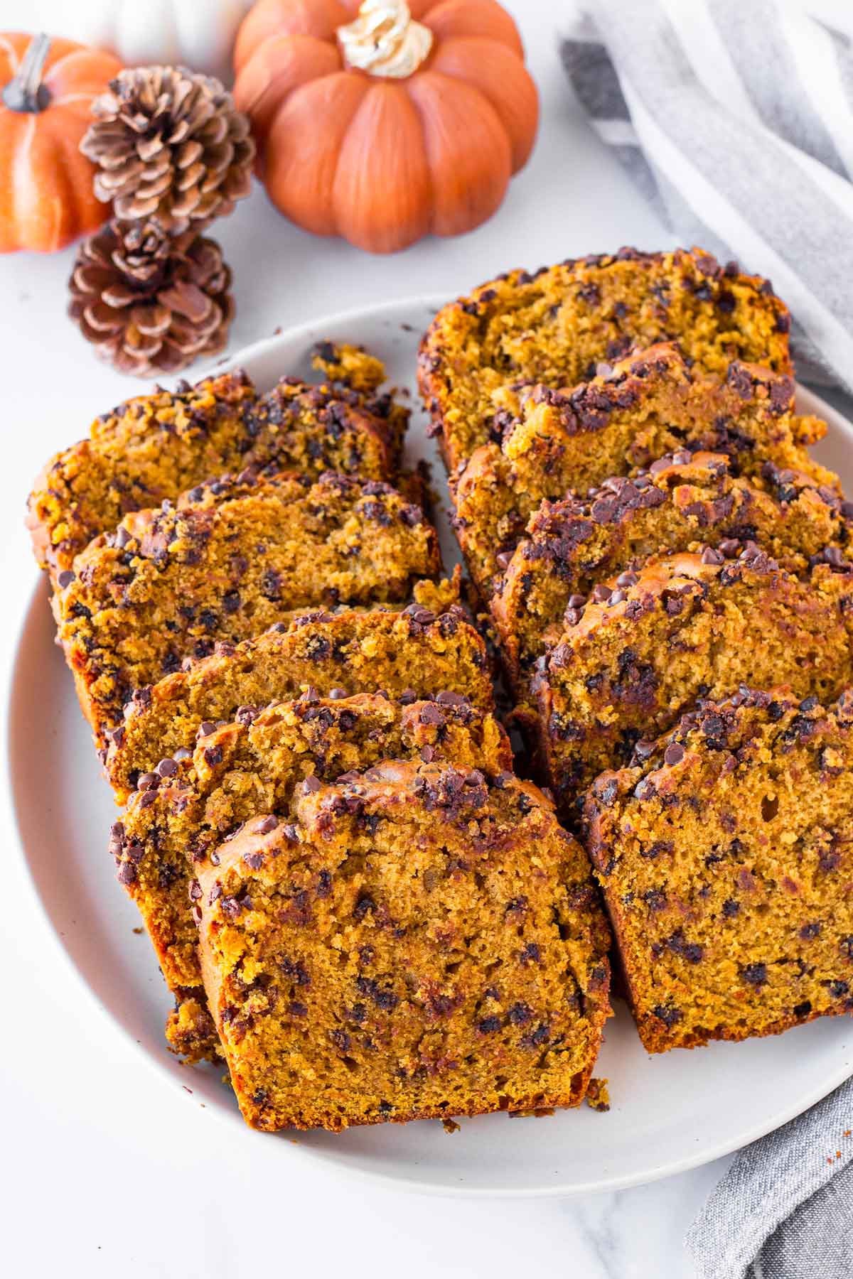 slices of pumpkin chocolate chip bread arranged on a plate