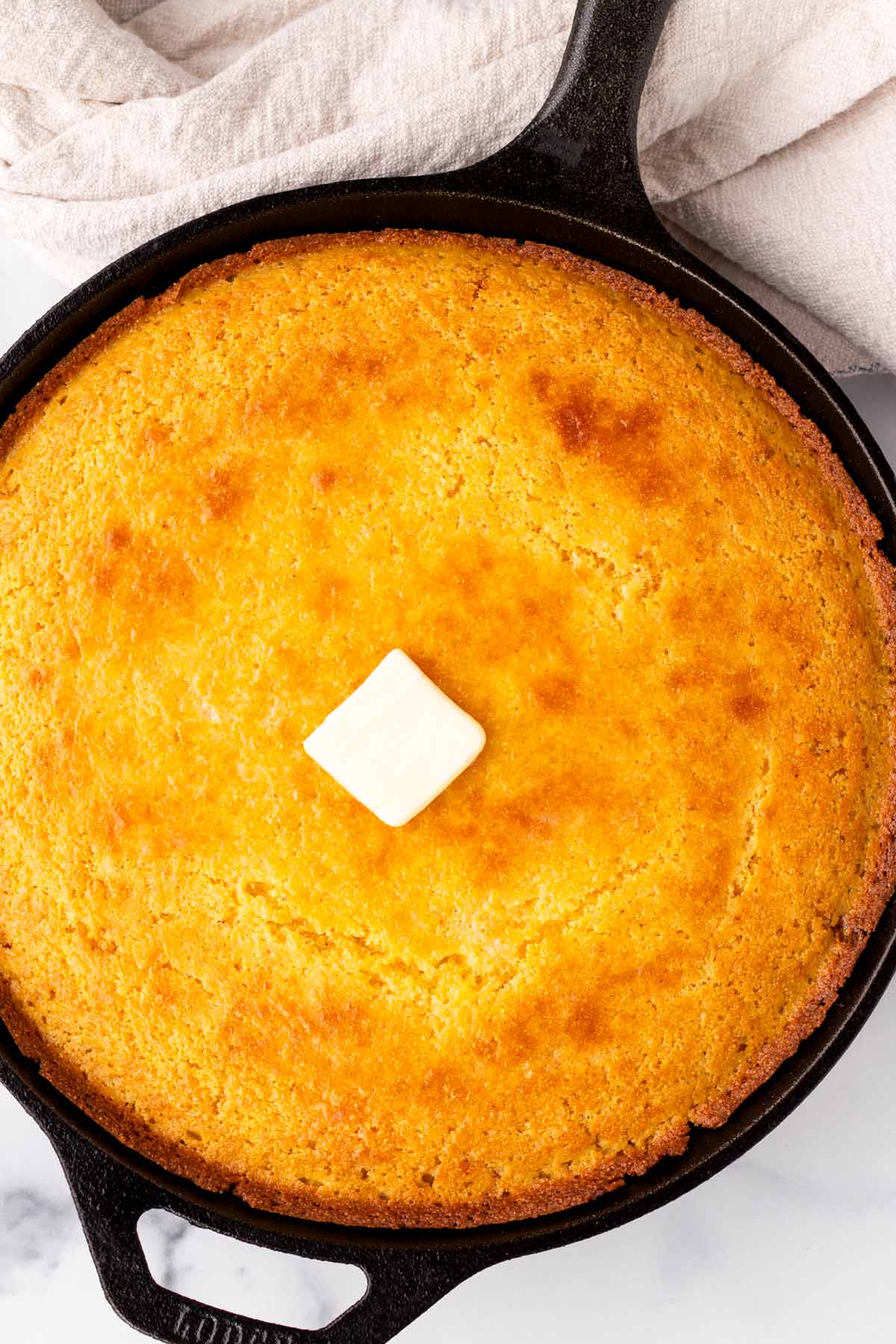 cast iron skillet cornbread with butter on top