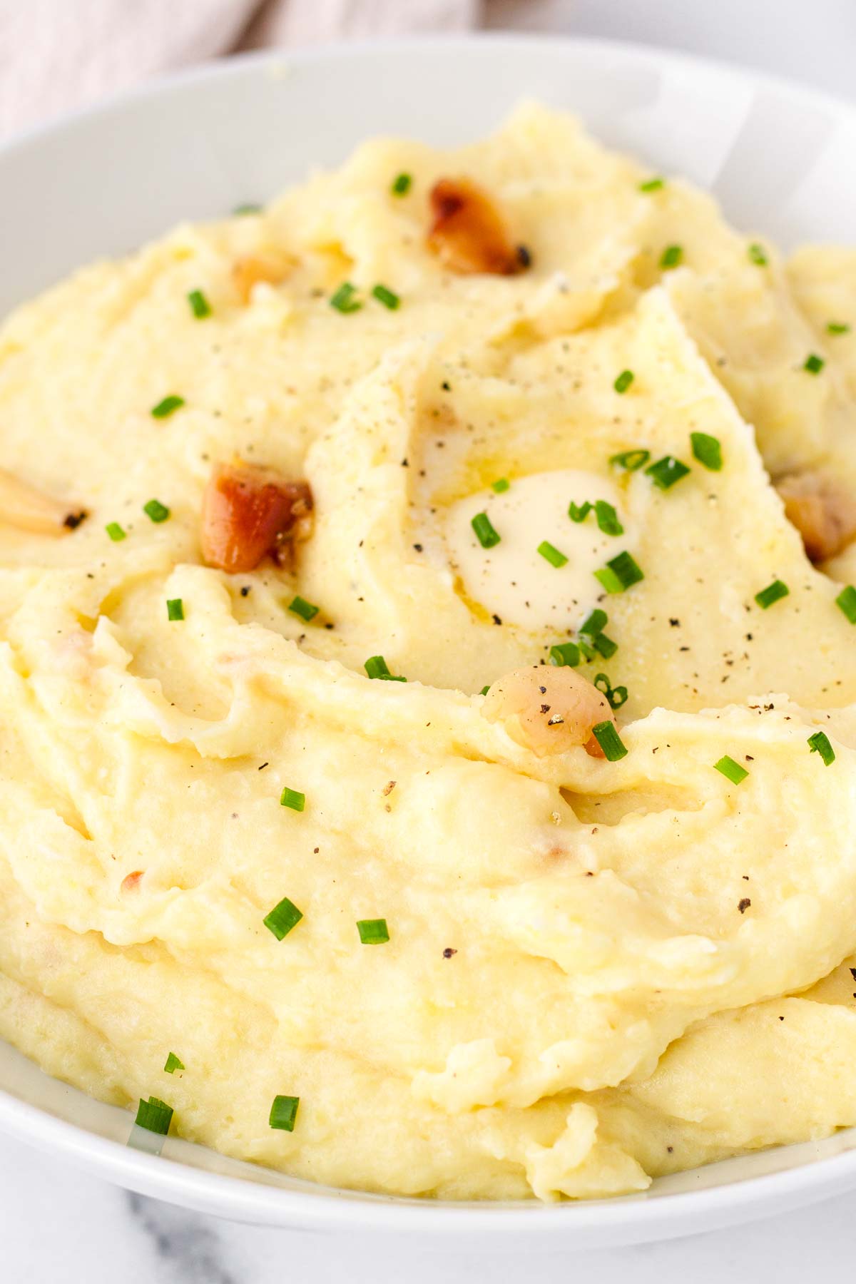 close up of mashed potatoes with roasted garlic