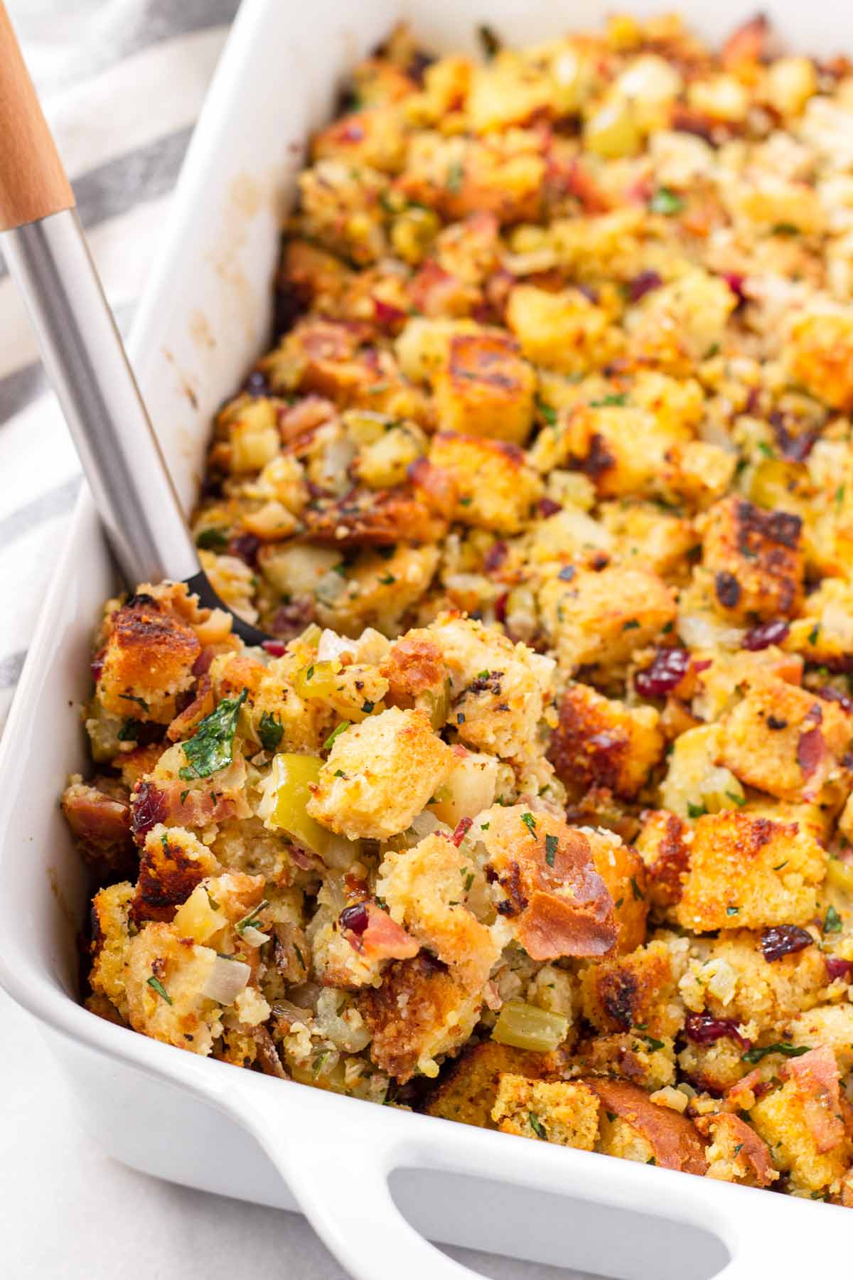 scooping a serving of cornbread stuffing