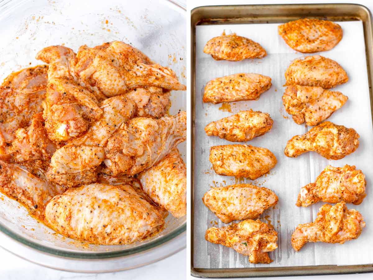 uncooked chicken wings tossed with rub arranged on pan