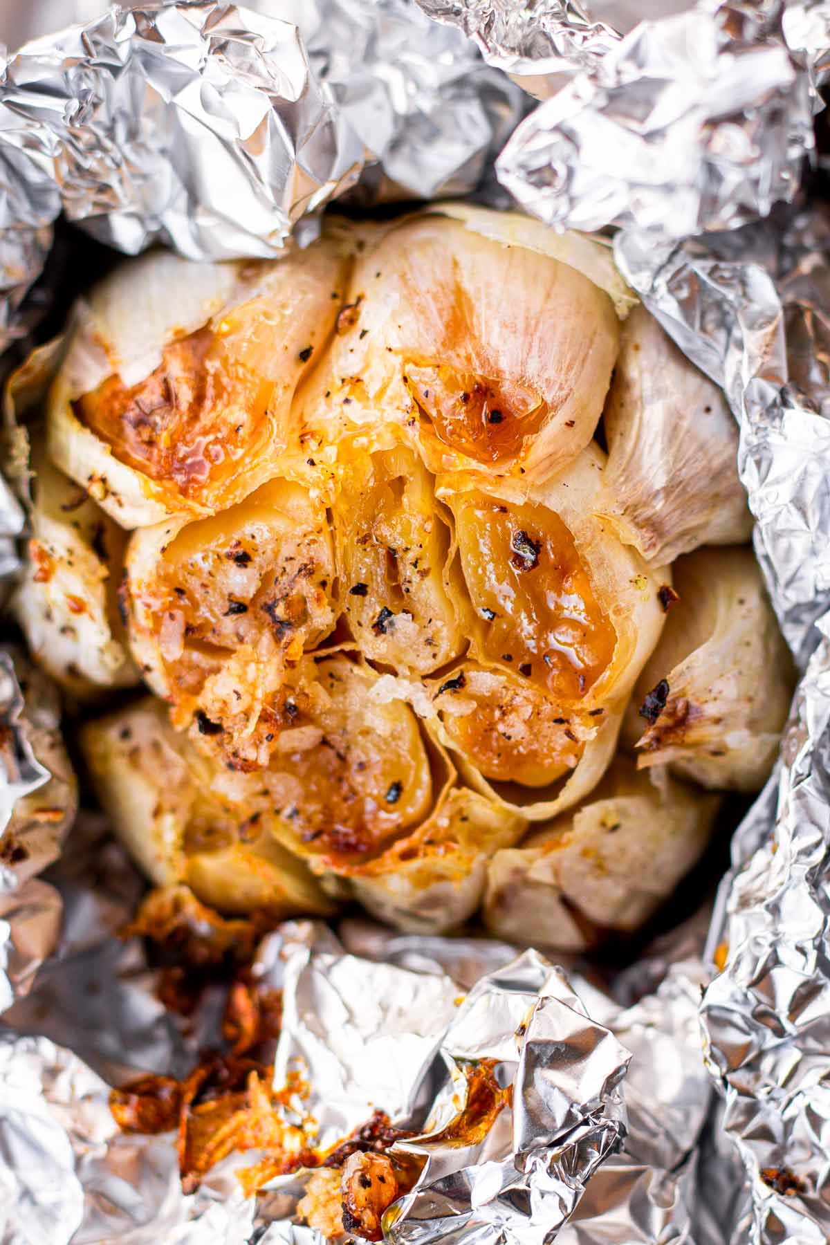 whole head of roasted garlic in foil