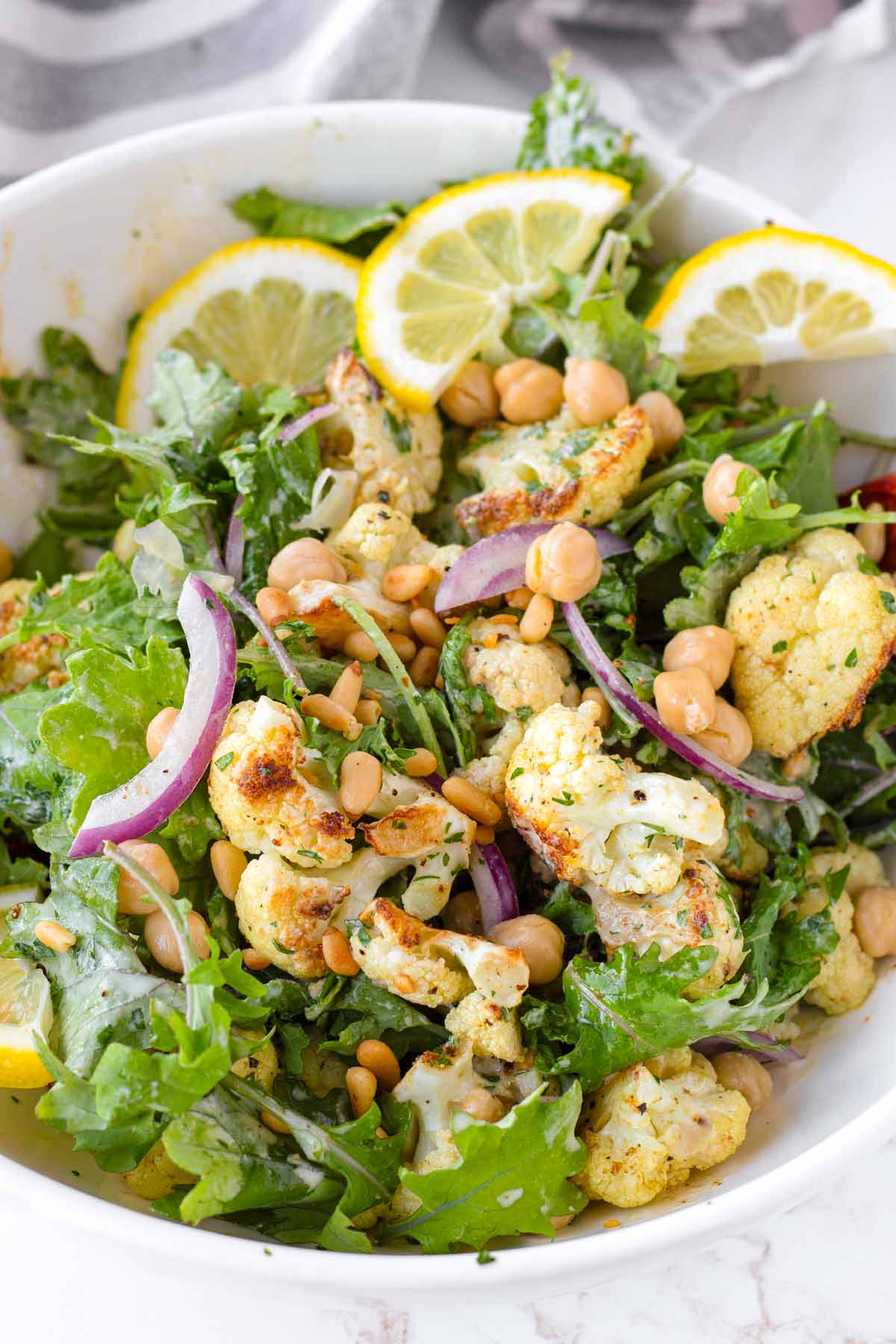 a bowl with kale and roasted cauliflower salad