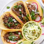 shredded barbacoa tacos with toppings