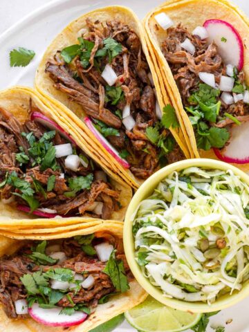 shredded barbacoa tacos with toppings