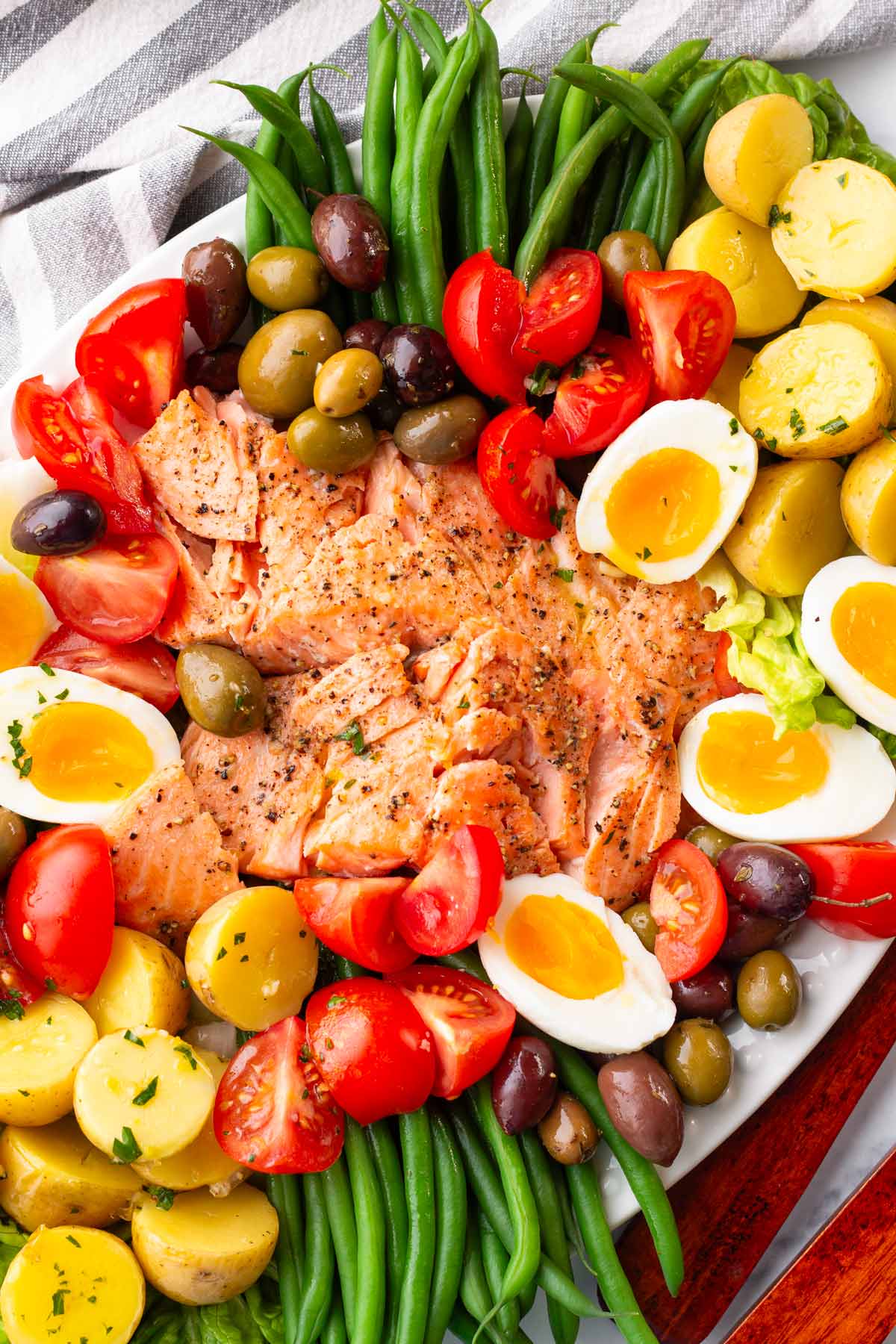 beautiful platter of salad nicoise with baked salmon