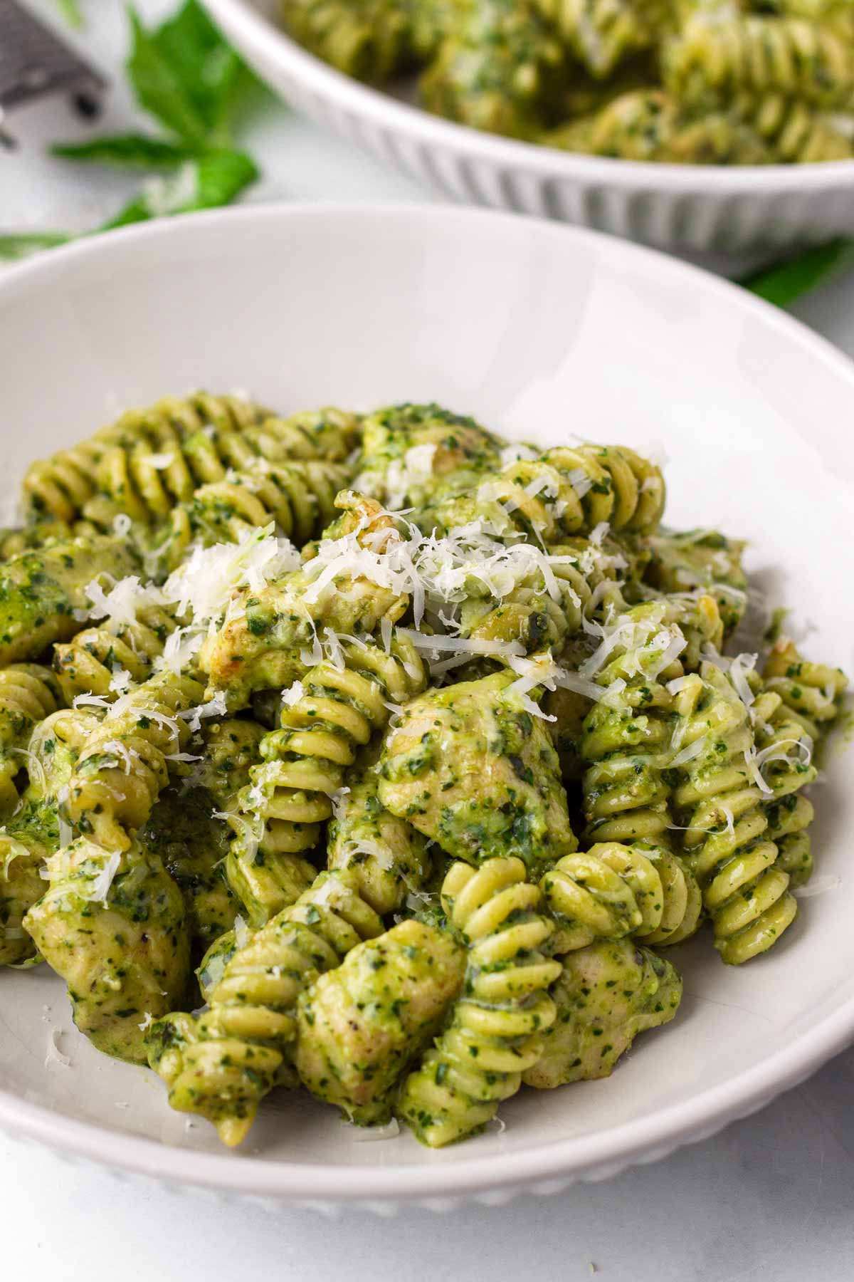 a bowl of chicken pesto pasta