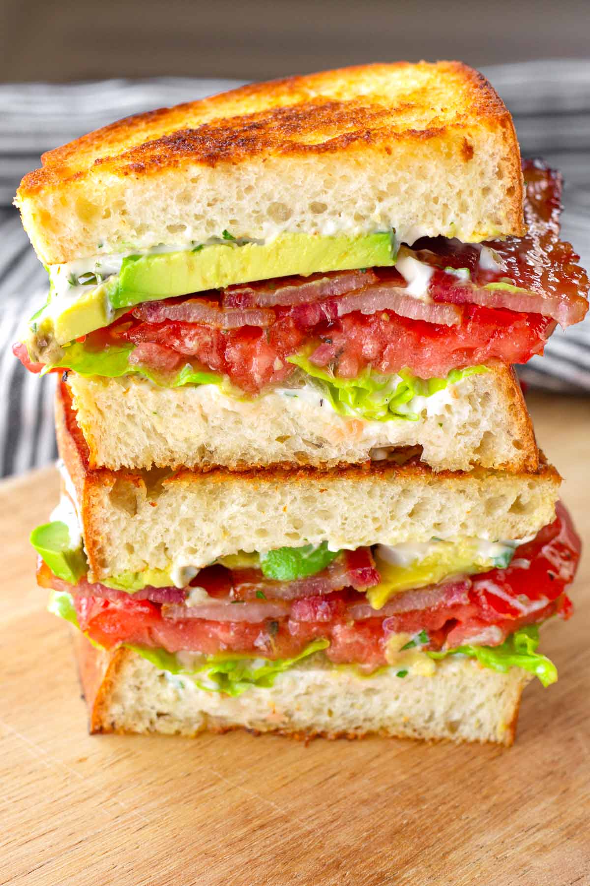 sliced in half avocado blt