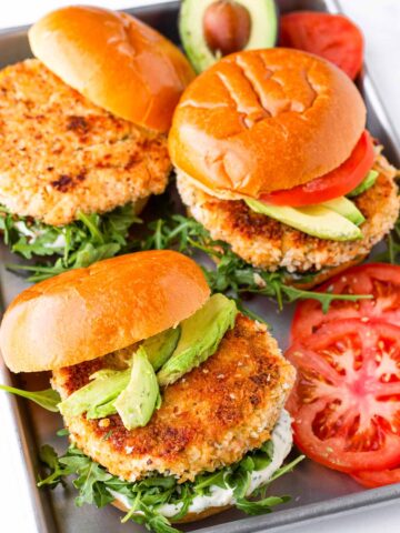 three salmon burgers on sheet pan