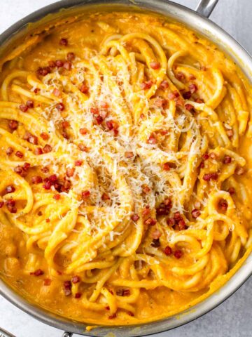 creamy butternut squash pasta topped with pancetta and cheese