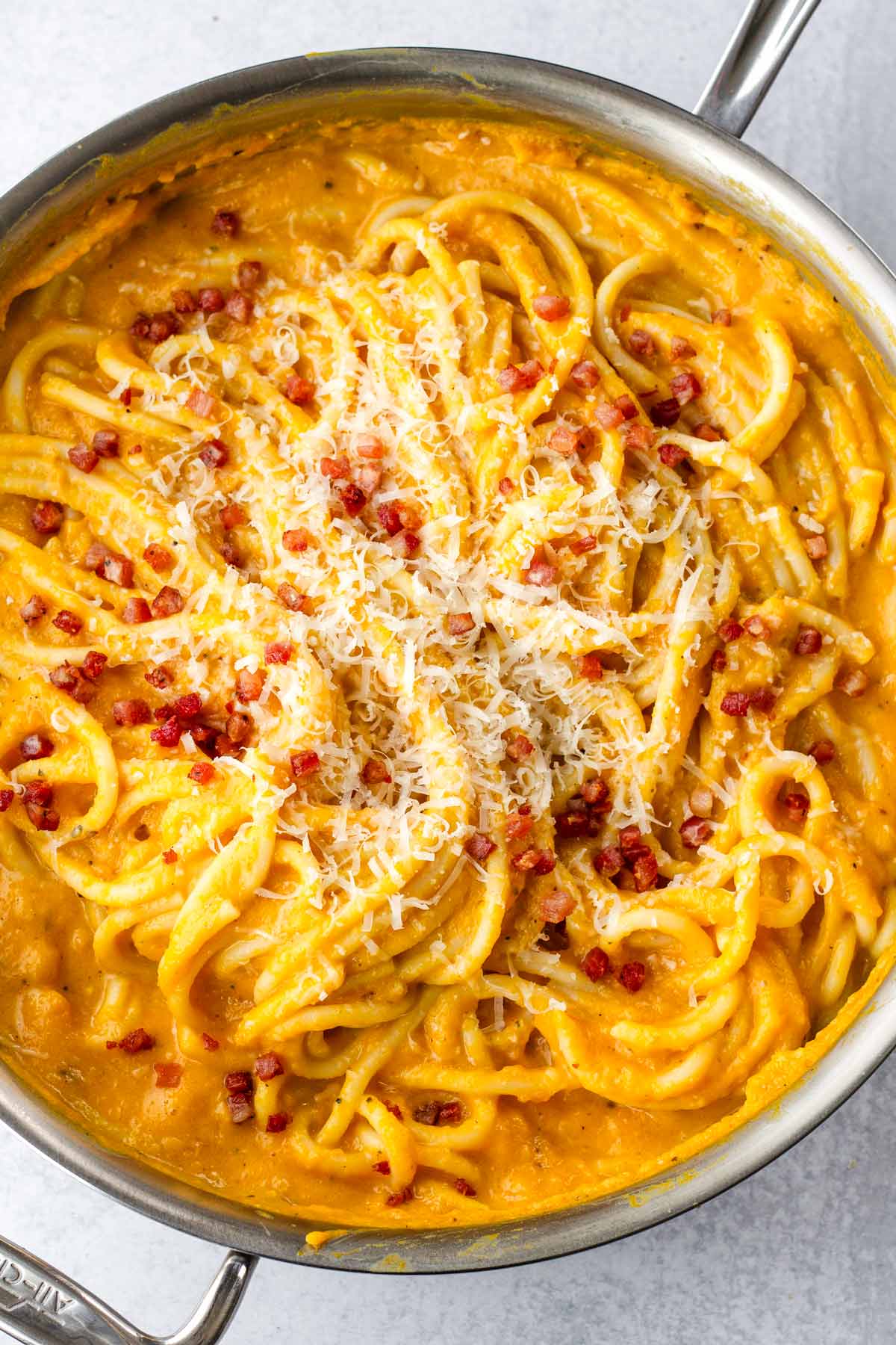 creamy butternut squash pasta topped with pancetta and cheese