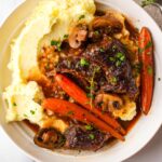 red wine braised beef with mashed potatoes and carrots