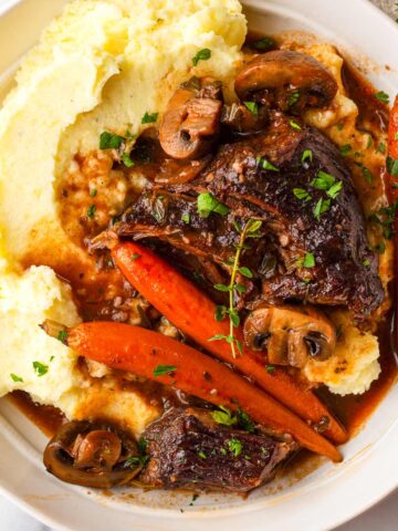 red wine braised beef with mashed potatoes and carrots