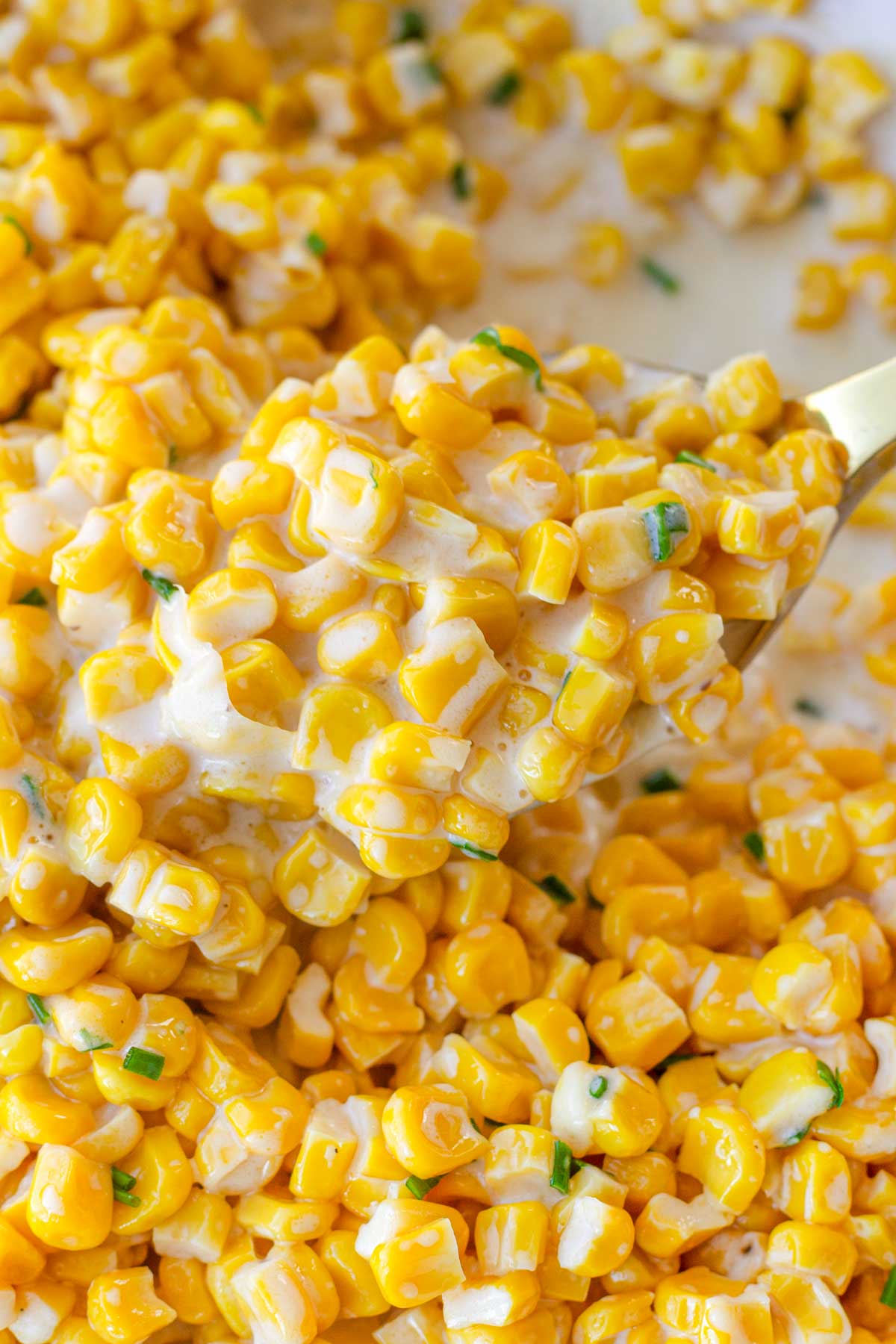 a scoop of creamy honey butter corn