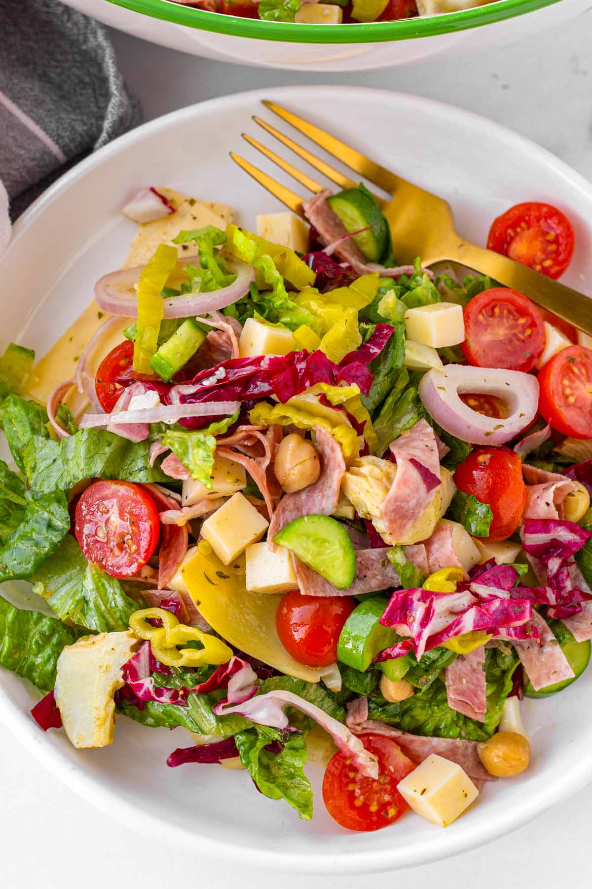 a plate with salad and a fork