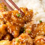 honey sesame chicken with chopsticks