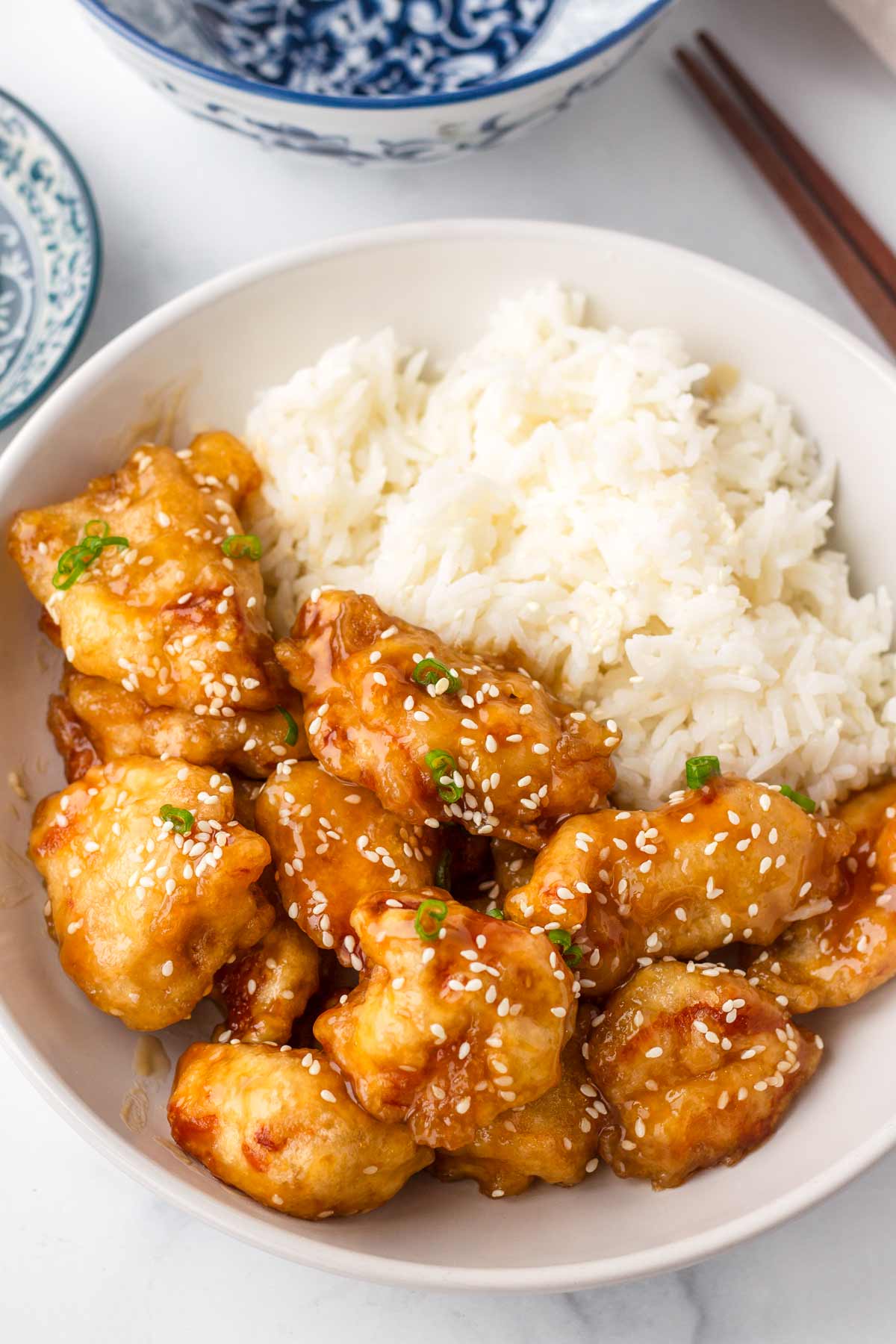 rice and sesame chicken in bowl