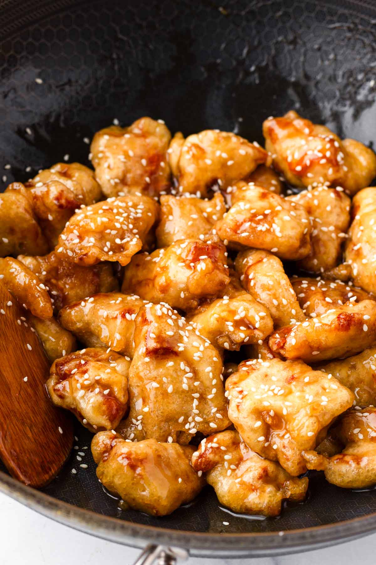 honey sesame chicken in wok