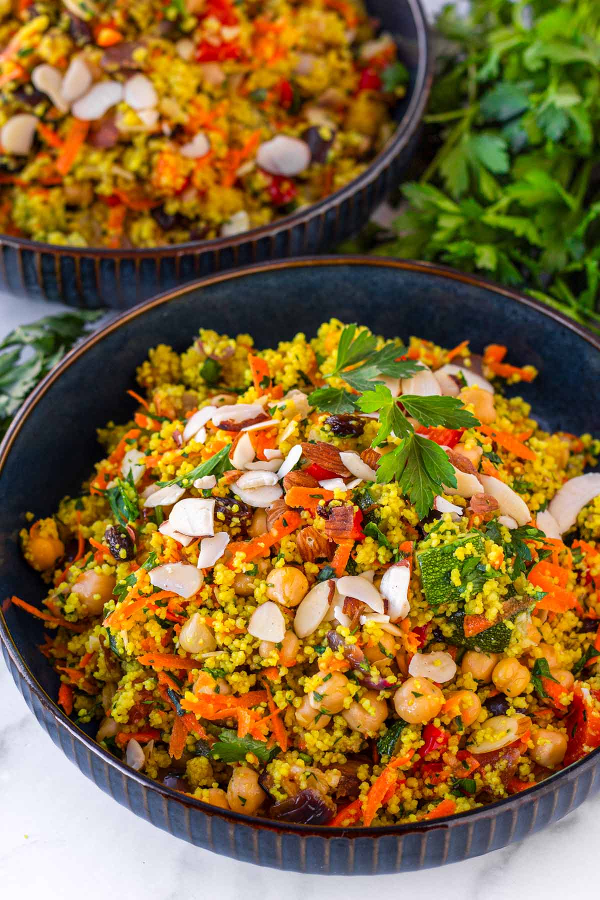 couscous salad served in a blue bowl