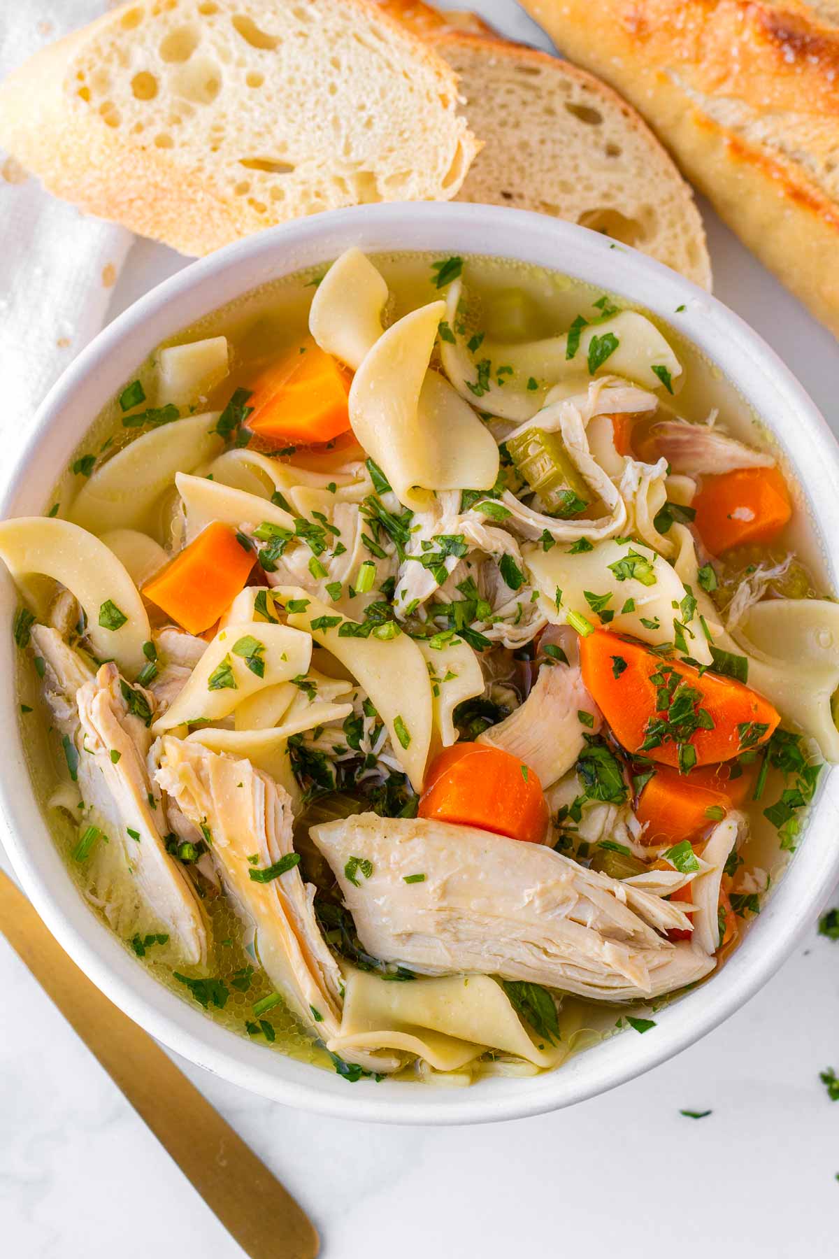 chicken noodle soup bowl with bread