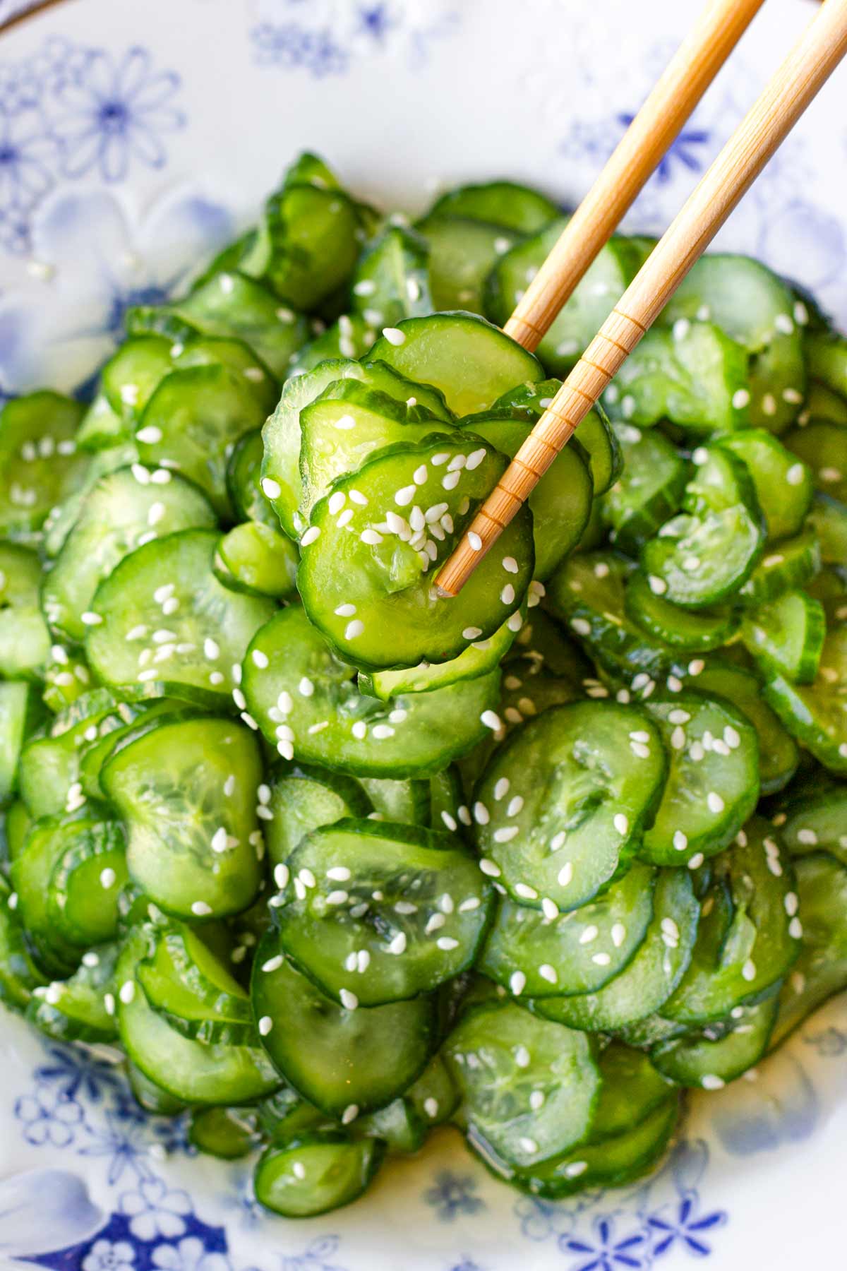 picking a few japanese cucumber slices with chopticks