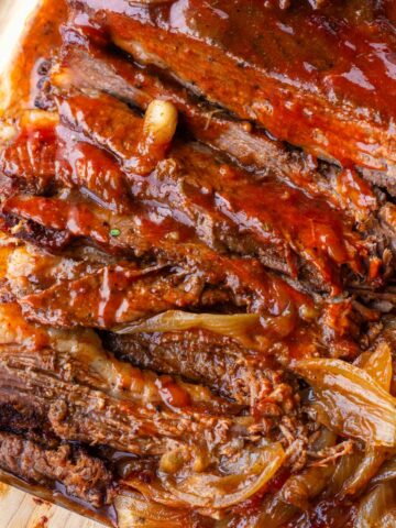 sliced slow cooker beef brisket with sauce