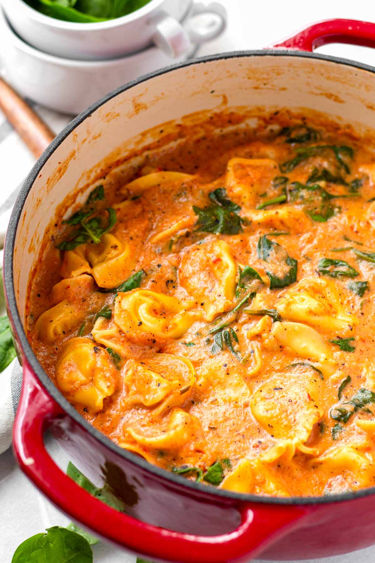 creamy tomato tortellini soup in red dutch oven