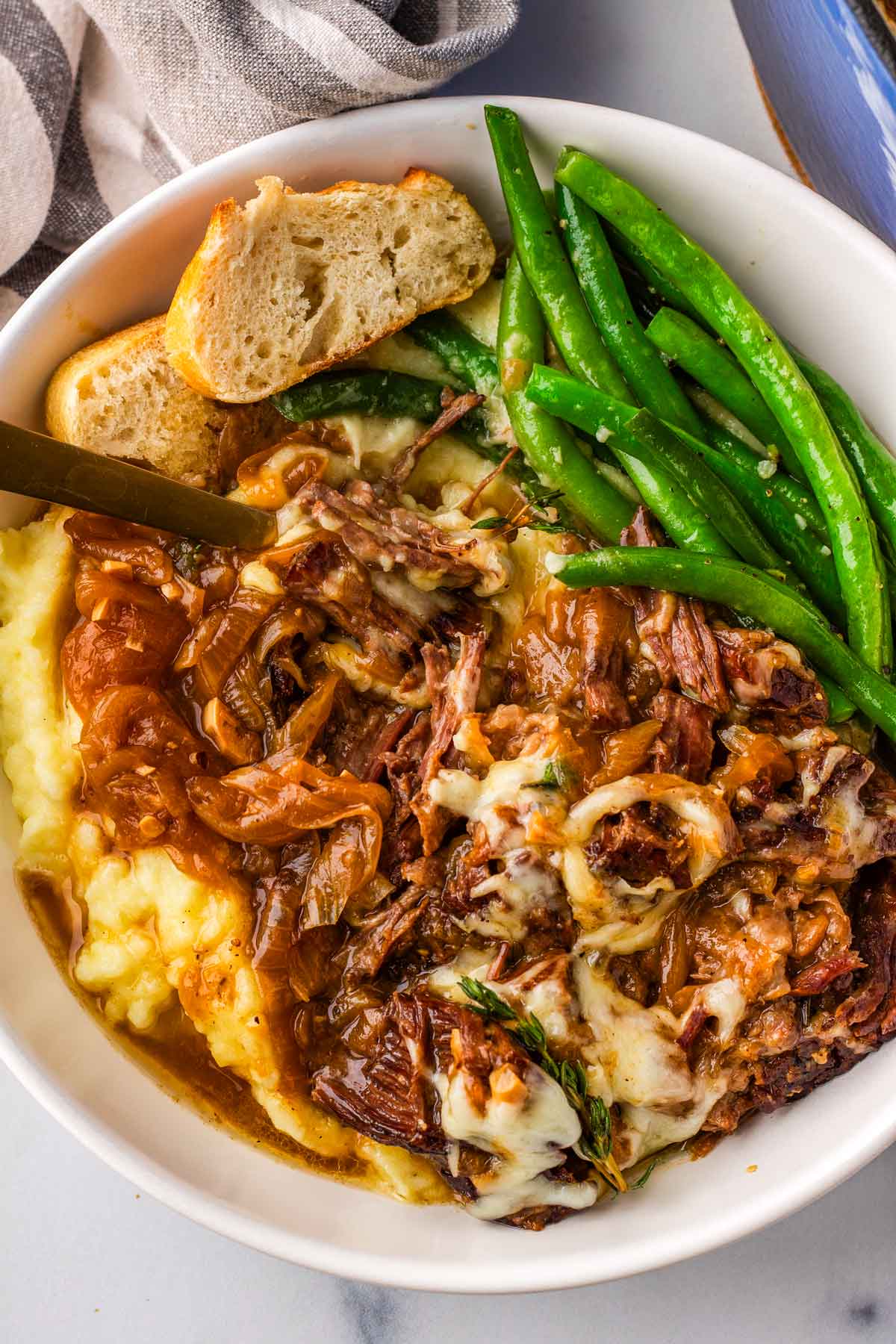 french onion pot roast over mashed potatoes and green beans