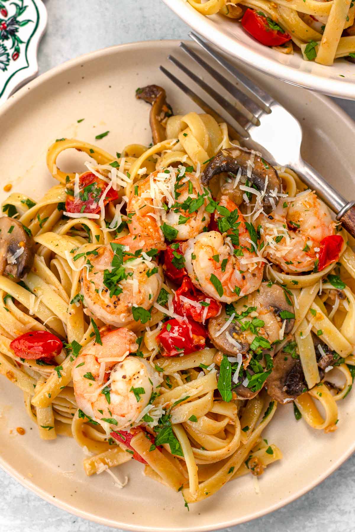 a serving of garlic shrimp pasta on a plate