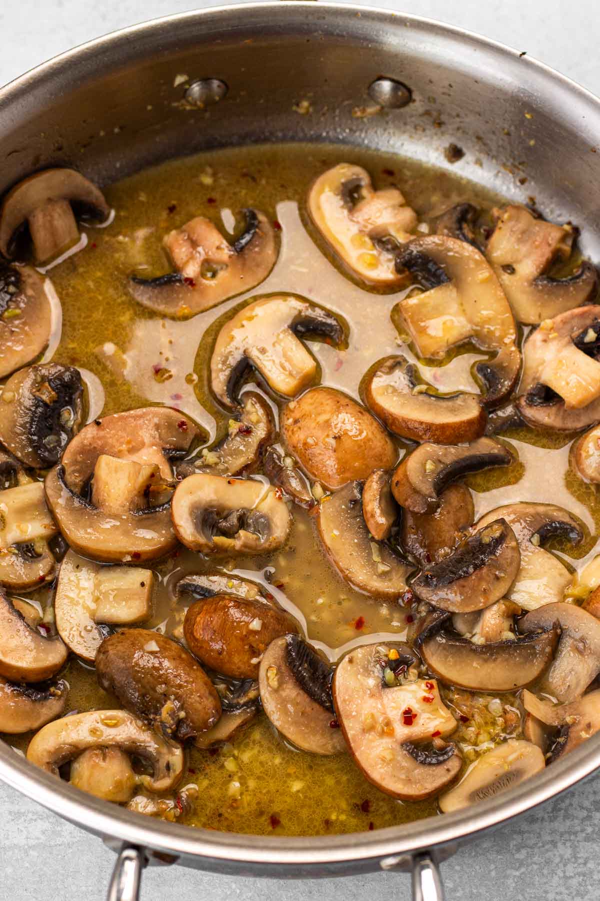 sauteing mushrooms with seasoning and wine