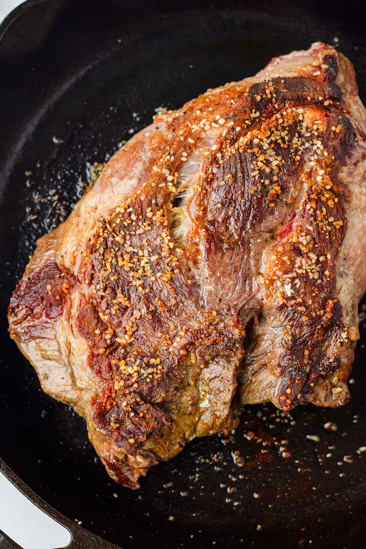 seared chuck roast on cast iron skillet