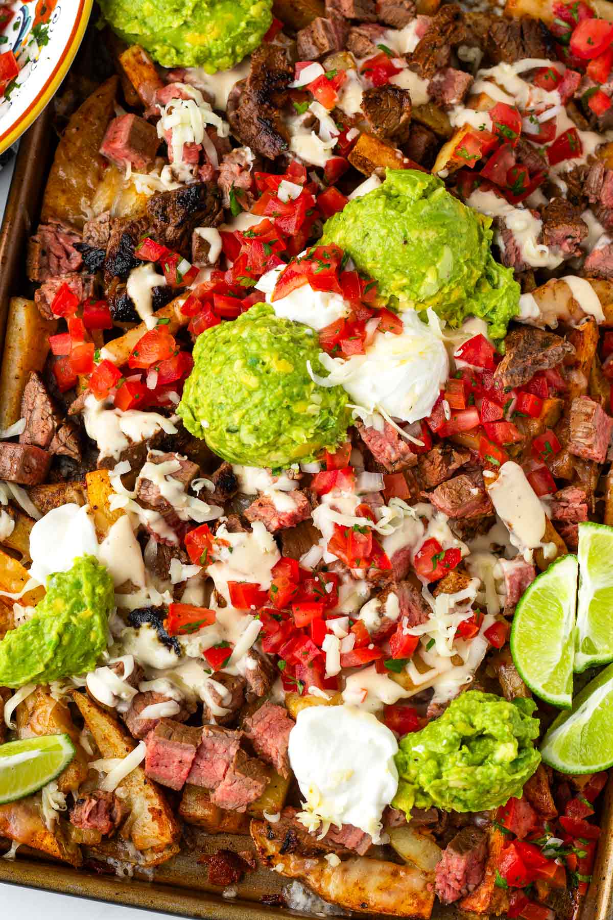 carne asada fries with guacamole and pico de gallo