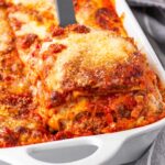 serving a piece of lasagna