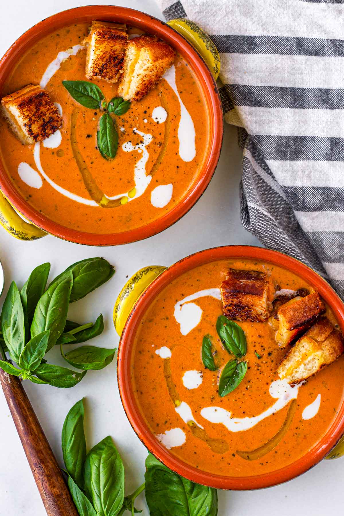 two bowls of tomato bisque soup