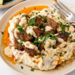 creamy garlic steak bites over mashed potatoes