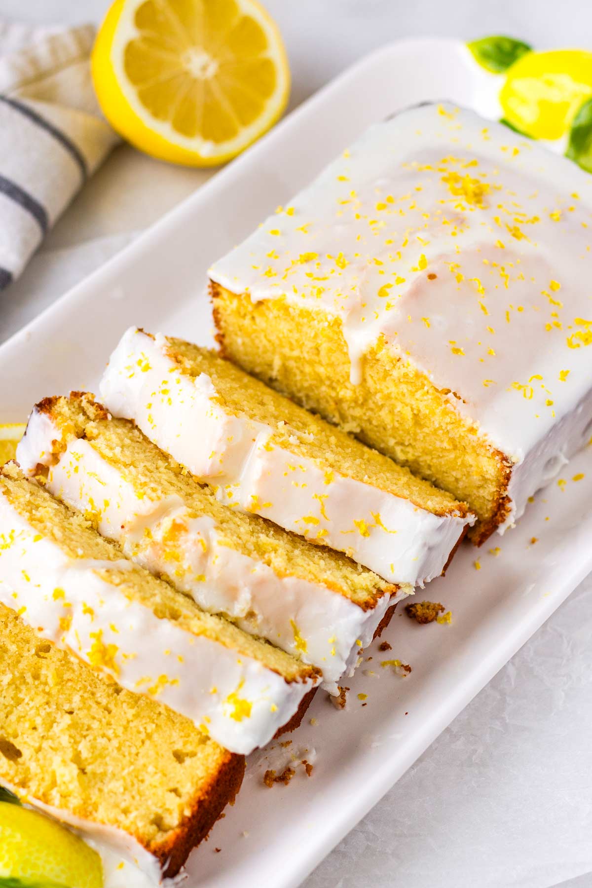 sliced lemon loaf cake with glaze