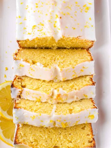 sliced lemon loaf cake on platter