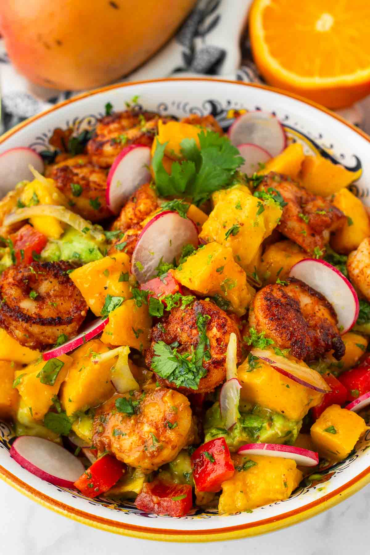 shrimp salad with avocado and mango in a bowl