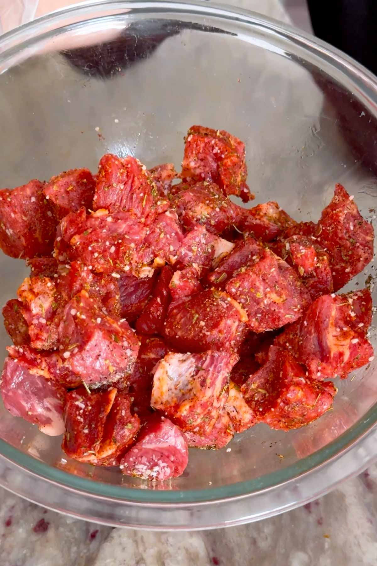 seasoned ny strip cubes in a bowl