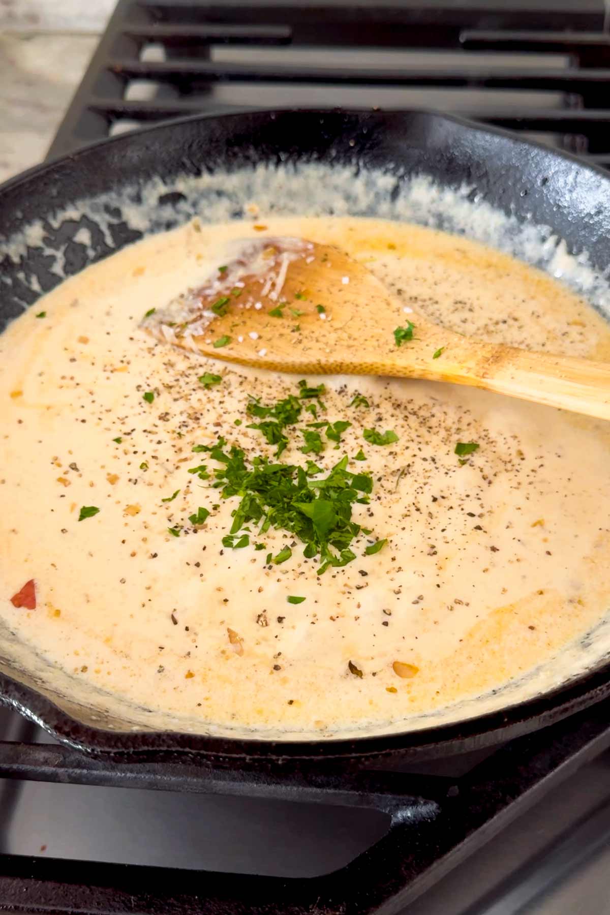 making creamy sauce in a cast iron skillet