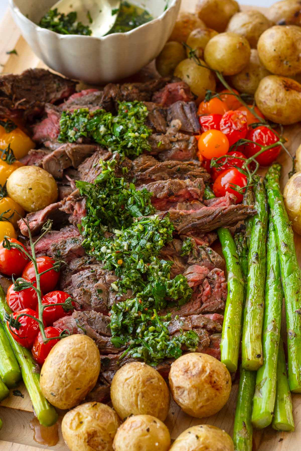 chimichurri steak with colorful grilled vegetables