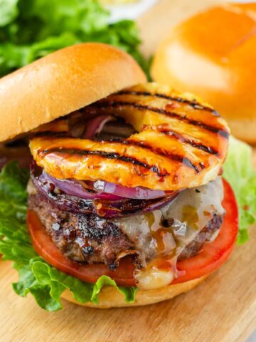 pineapple teriyaki burger on a wooden board