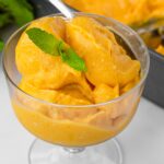 mango sorbet with coconut milk in a bowl