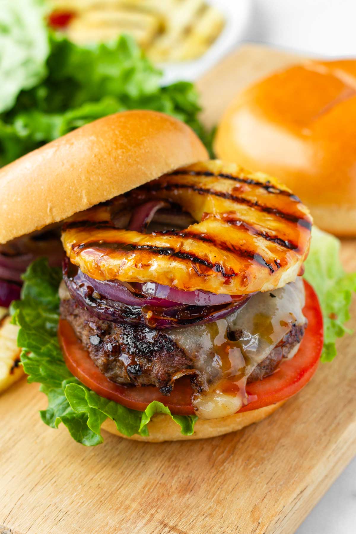 teriyaki burger with grilled pineapples